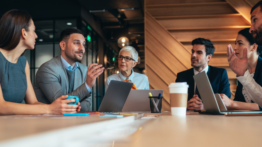 men and women working together on Ai ethics and society.