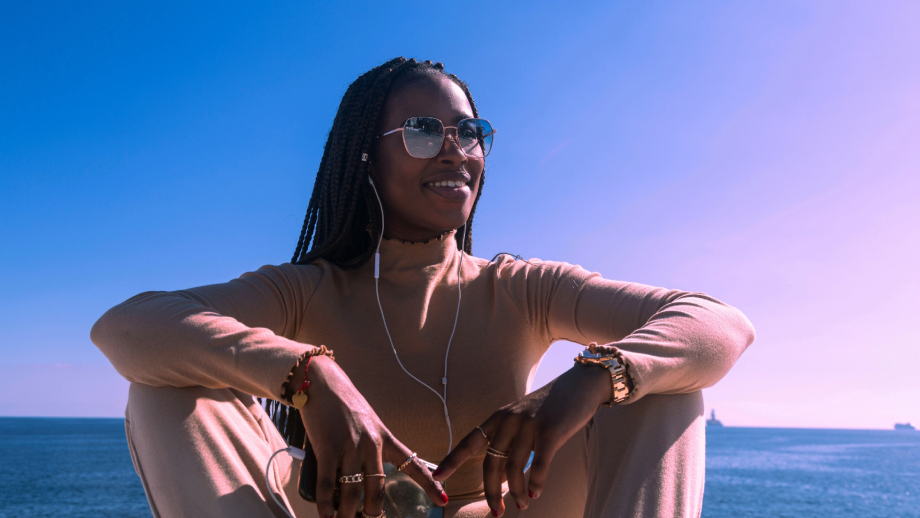 African american women sitting on a mountain thinking about stepping out on faith